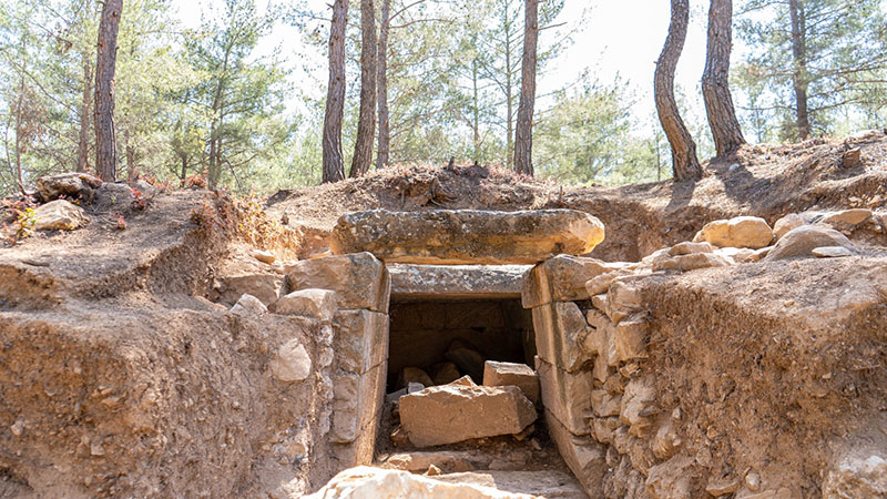 Woman's hand touches the historical excavations